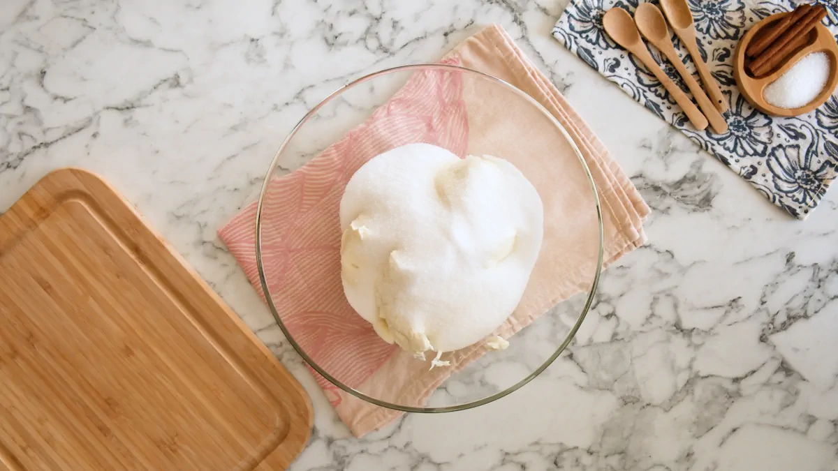 Softened cream cheese and monk fruit sweetener in a mixing bowl.