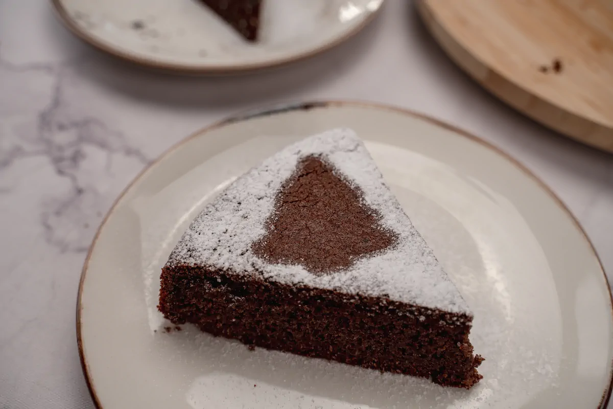 A focused shot of keto gingerbread cake dusted with powdered erythritol.