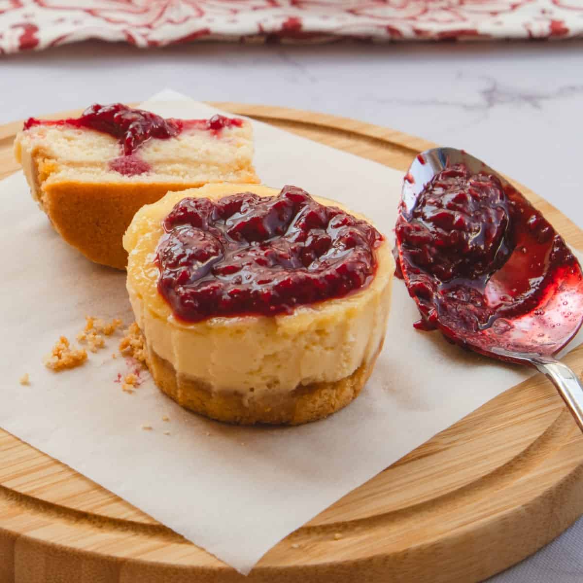 Mini cheesecake bites topped with keto-friendly raspberry jam.