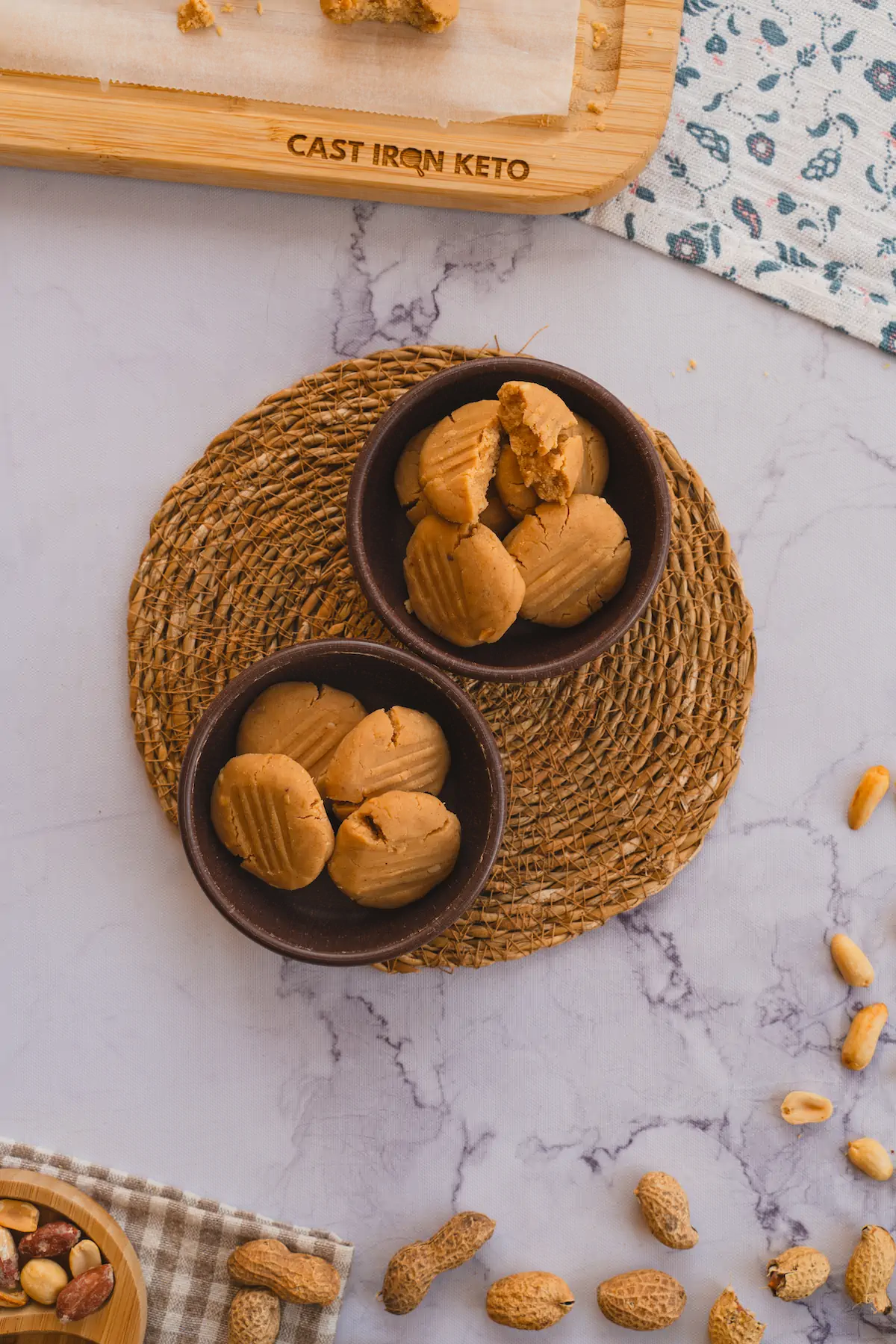 Homemade no-bake coconut cookies presented in two ceramic bowls.