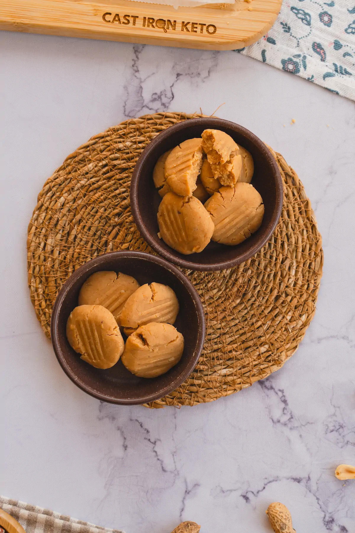Two ceramic bowls filled with no-bake coconut cookies.