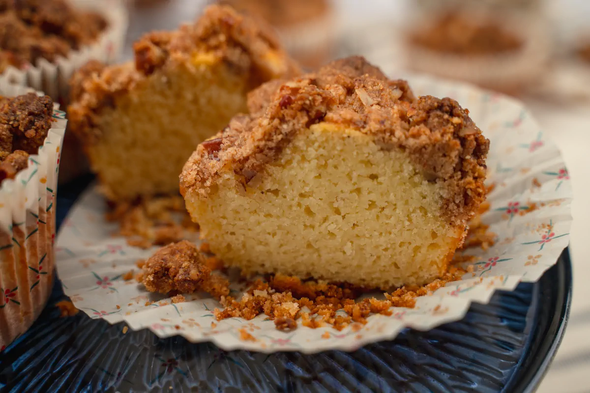 Homemade keto almond flour muffin sliced midway showing the texture.