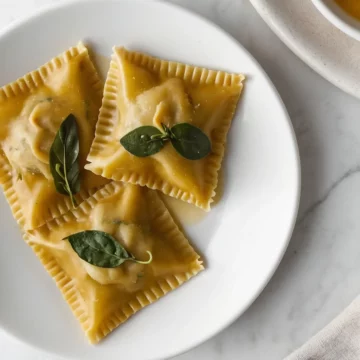 Keto ravioli served on a white ceramic plate.