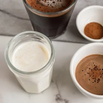 Keto coffee creamer in a transparent glass.