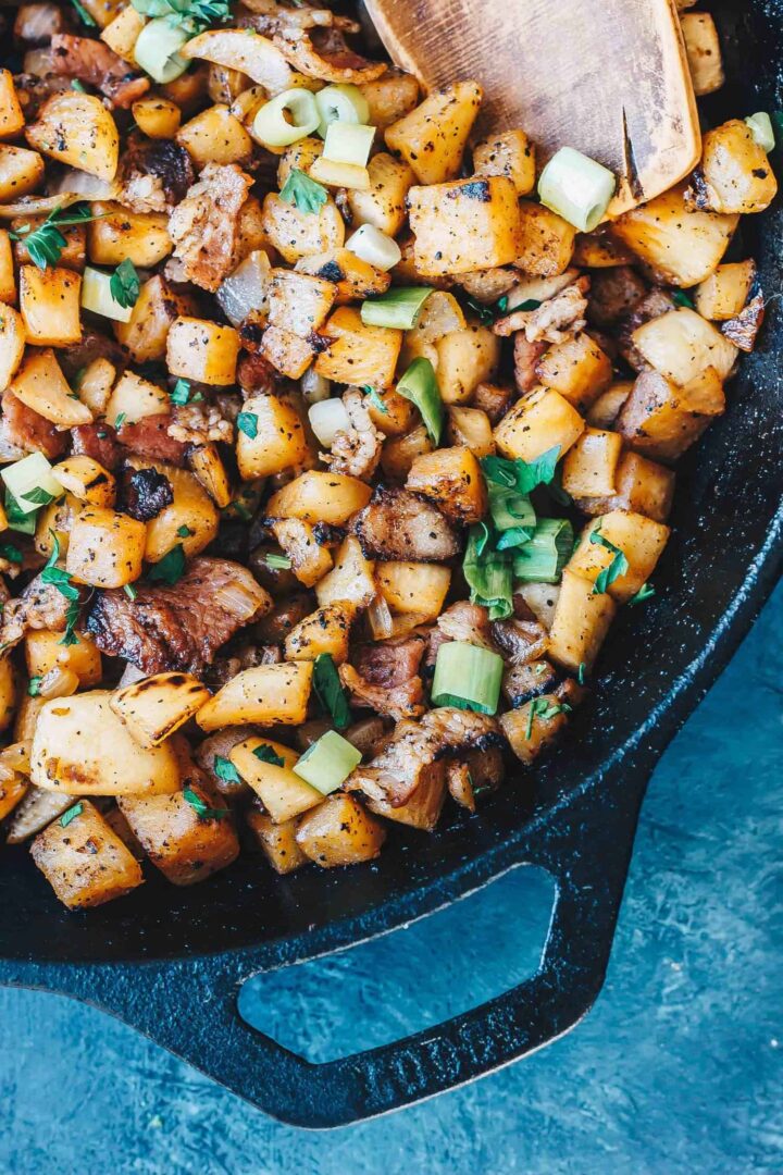 Keto Breakfast "potatoes" in a cast iron skillet with spatula