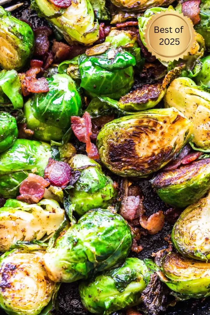 Crispy Brussels sprouts sautéed with bacon pieces in a skillet, with caramelized edges and vibrant green color.