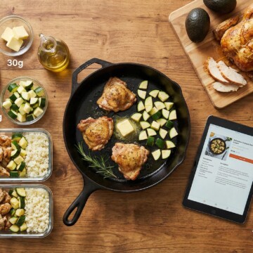 Overhead view of a kitchen counter with both structured meal prep and casual cooking elements, representing Strict and Lazy Keto styles.