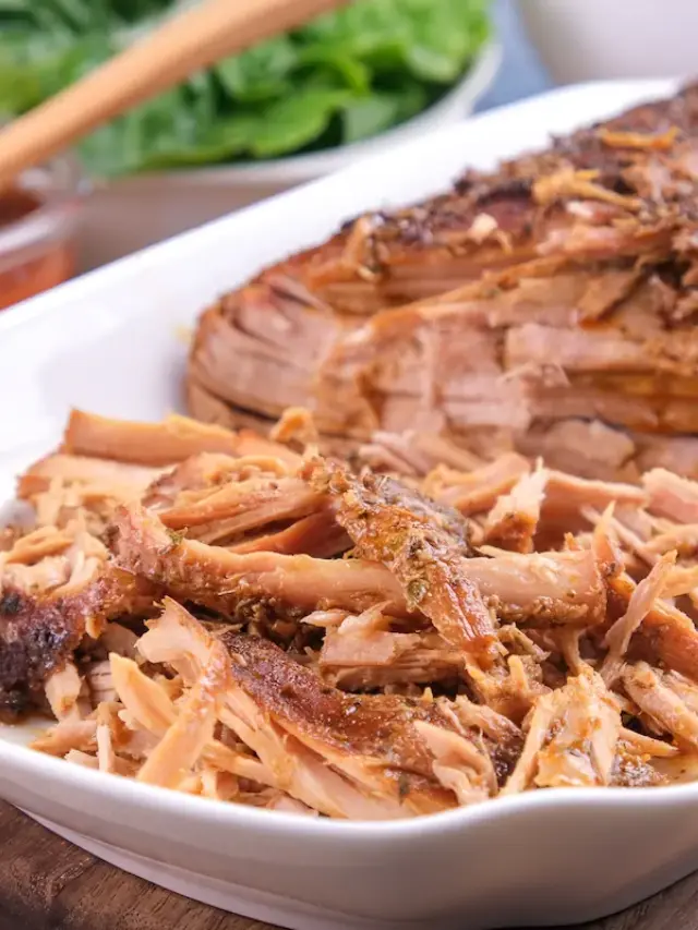 Keto pulled pork was shredded with a fork and reached halfway.